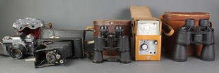 A No.1A Kodak pocket folding camera, a Minolta XE-1 camera with Minolta lens 1:7.1 F=50mm, a Telstar 10 x 40 binoculars, a pair of 10 x 50 binoculars and a BT meter 