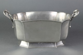 A Continental pewter boat shaped twin handled planter/dish of panelled form 4 1/2" x 11 1/2" 