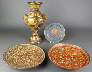 An Indian engraved and enamelled brass vase 14", ditto bowl and plate 10", ditto plate decorated peacocks 8" 