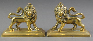 A pair of 19th Century brass fireside ornaments in the form of standing crowned lions 3" 