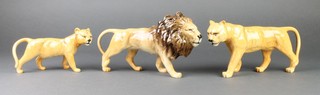3 Beswick figures of a lion 10", a lioness 9" and a lion cub 7" 