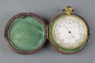 A 19th Century pocket barometer with 1 1/2" silvered dial contained in a gilt metal case, the reverse marked Lewis A Smart, contained a leather case 