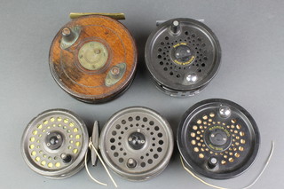 A Leeda Magnum 200D salmon fly fishing reel and spare spool, a 4 1/2" wood and brass starback fishing reel with slatter latch, an Intrepid fly fishing reel and 1 other reel 