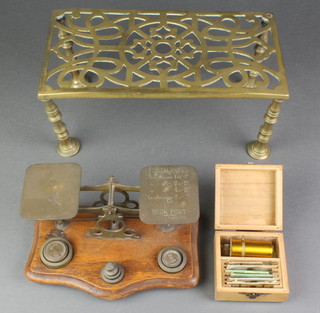 A pair of brass and mahogany letter scales complete with weights, a small field microscope 2" and a brass trivet 