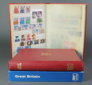 An album of various GB mint and used stamps, a Stanley Gibbons album of various 20th Century mint and used stamps, a red stock book of various GB stamps 