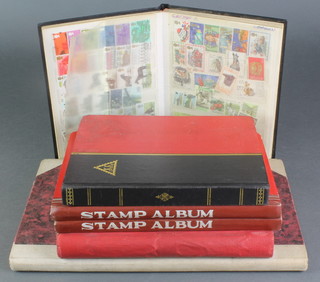 5 stock books of used world stamps, a Cardinal red stamp album of world stamps
