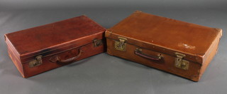 A brown leather suitcase with brass mounts 6" x 24" x 13" together with a pressed cardboard case 7" x 25" x 17" 