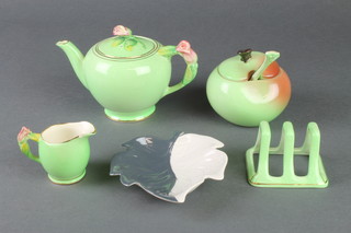 A Royal Grimwades floral teapot and jug, a Carltonware preserve pot and spoon, a 3 bar toast rack and leaf dish 