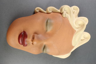 An Art Deco female face mask inscribed Ian Douglas 9" 