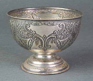 An Edwardian repousse silver pedestal bowl with floral decoration and vacant cartouches 4", Birmingham 1903, 120 grams