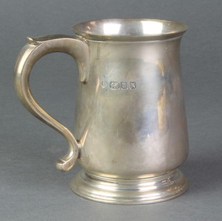 A silver baluster mug with S scroll handle, London 1945, 208 grams