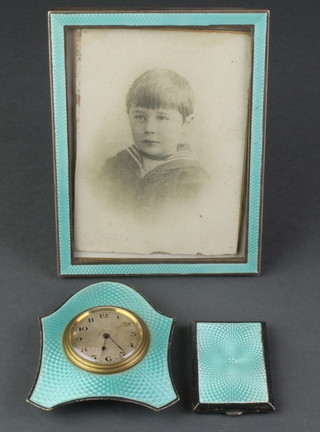 A silver and green guilloche enamelled bedroom timepiece, ditto photograph frame and match sleeve Birmingham 1927