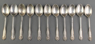 11 fancy silver teaspoons, engraved Wimbledon Lawn Tennis Club, 144 grams