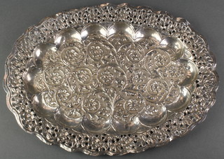An Indian repousse and pierced silver oval dish decorated with flowers 142 grams 