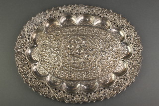 An Indian repousse and pierced silver  oval dish decorated with flowers 182 grams