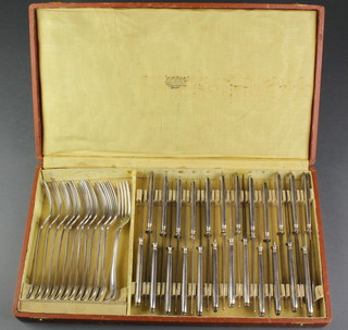 A cased canteen of French silver dessert eaters comprising 12 forks and 24 knives 