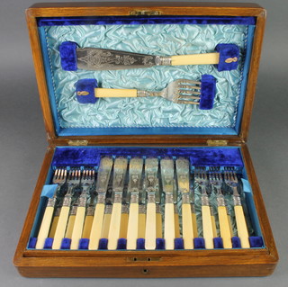 An Edwardian canteen of silver plated fish eaters and servers for 12 
