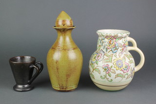 A Studio Pottery decanter and stopper 10", a ditto cup 4" and an Art Deco bulbous jug 