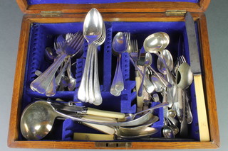An oak canteen containing a quantity of silver plated cutlery 