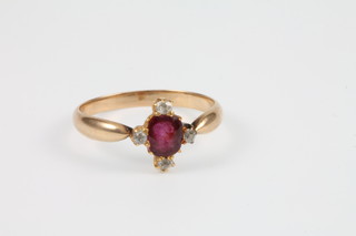 A yellow gold diamond and ruby ring, size L 1/2 