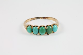 A yellow gold turquoise set 5 stone ring, size L 1/2