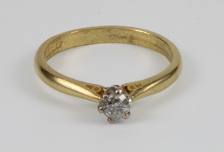 An 18ct yellow gold single stone diamond ring, size L