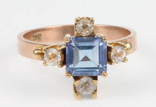 A tanzanite and gem set yellow gold ring, size L