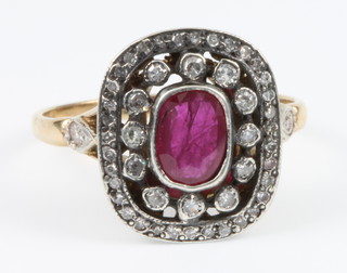 An 18ct yellow gold ruby and diamond ring, size L 1/2