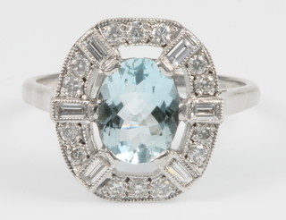 An 18ct white gold aquamarine and diamond ring, the centre stone approx. 1.5ct surrounded by .5ct of diamonds, size P