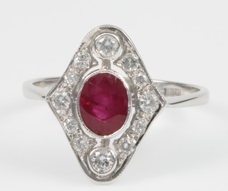 An 18ct white gold ruby and diamond Art Deco style up finger ring, size M