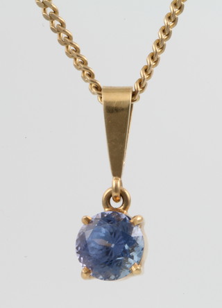 A 9ct gold flat link chain with an 18ct set tanzanite pendant 