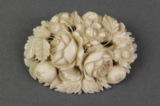 A carved ivory floral brooch