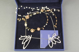 A Swarovski boxed necklace and 2 other necklaces