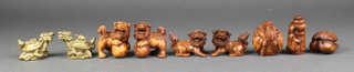 7 modern carved wood netsukes and 2 brass figures 
