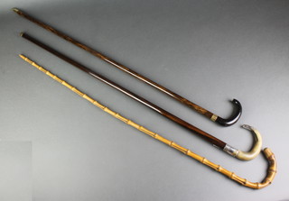 A silver mounted walking cane with horn handle, 1 other and a bamboo ditto 