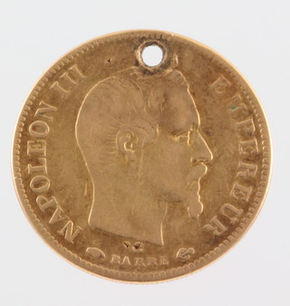 An 1857 10 franc (drilled) 