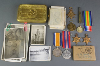 Family medals, World War One trio to 2283 Gunner J.E.Poplett R.F.A., a 1914 chocolate tin and bullet pencil, a pendant together with a World War Two trio 1939-45 Atlantic Star and War medal, a posting box and later photographs
