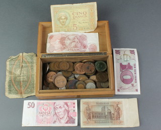 A quantity of UK and foreign coins and bank notes