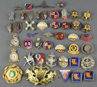 A quantity of enamelled Butlins and sporting badges