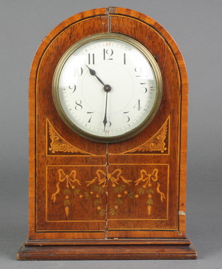 A bedroom timepiece with enamelled dial and Arabic numerals contained in an inlaid mahogany case