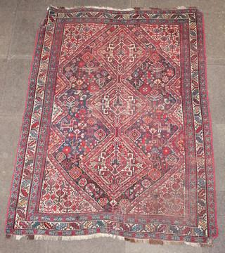 A Persian Qashqai rug with 3 diamonds to the centre within multirow borders 76" x 55" 