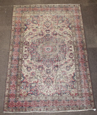 An Antique Persian Isfahan green ground rug with central medallion 86" x 55" 