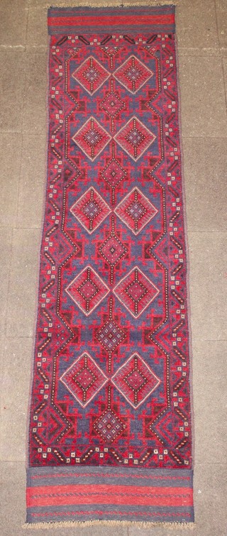 A Meshwami red and blue ground runner with 10 diamonds to the centre 120" x 24" 