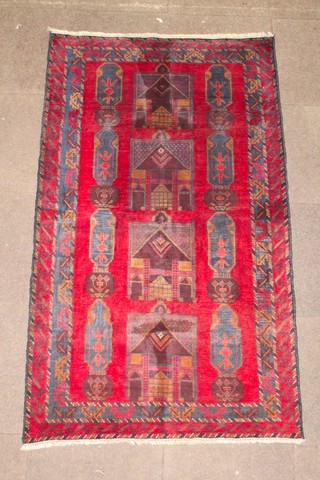 A red and tan ground Persian rug with panelled decoration 75" x 43" 