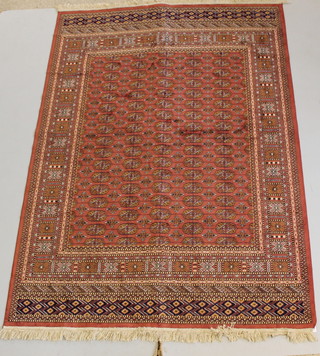 A Belgian cotton peach ground Bokhara style carpet 89" x 64" 