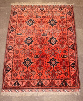 A red ground Persian rug with all-over geometric design 69" x 51" 