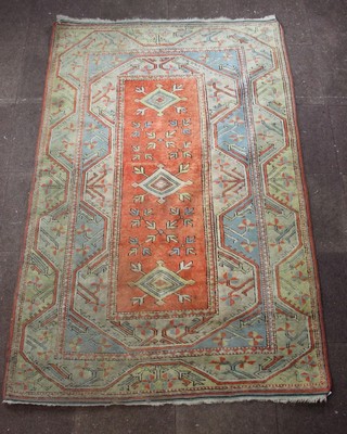 A Caucasian style rug with 3 diamonds within central medallion 96" x 64" 
