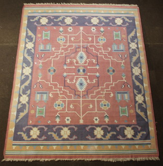 A pink ground Kelim carpet with geometric designs 124" x 96"