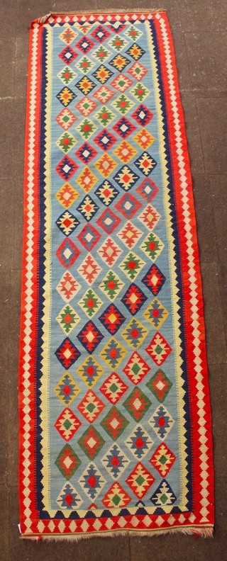 A blue ground Kelim runner with all-over diamond design 13 1/2" x 32"