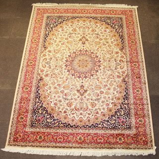 A gold ground Belgian cotton Persian style rug with central medallion 109" x 78 1/2" 